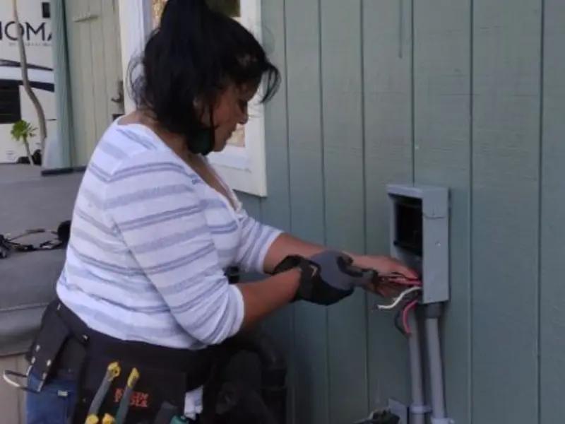 Licensed electrician wiring an exterior subpanel in Chester