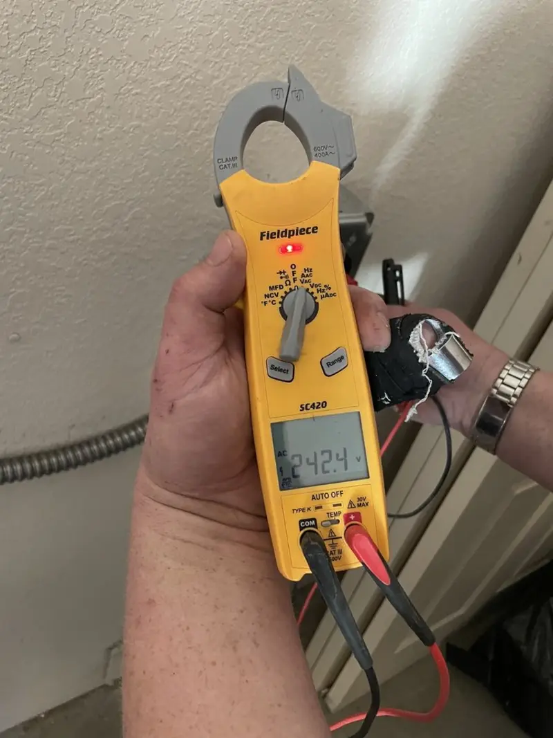 Voltage testing with clamp meter during Ceiling Fan Installation in Chester